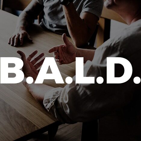 B.A.L.D. overlaid on top of two people having a conversation